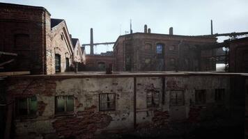 Abandoned factory with collapsing brick buildings over time in desolate location video