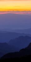 A view of the mountains at sunset photo