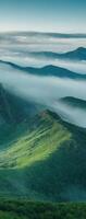 A view of the mountains and fog in the distance photo