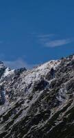 A mountain with snow on it photo