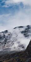 A large mountain with a small mountain on top photo