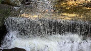 A small mountain river with a flow of water in the Polish mountains. Eastern Sudetes photo