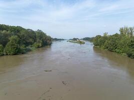 Mudflow of water in the Oder River of brown color. Poland. View from above. Background. photo