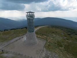 Observation tower on the peak of Mount Kralicky Sneznik, Eastern Sudetes on the border of Poland and the Czech Republic photo