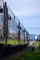 The train passes through the countryside with beautiful natural views. photo