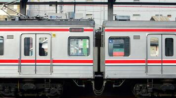 The train is running on the rails towards the destination photo