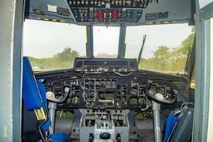 Detailed view of aircraft cockpit with control panels, gauges, and switches, showcasing aviation technology and complexity, Surabaya, 22 September 2024. photo