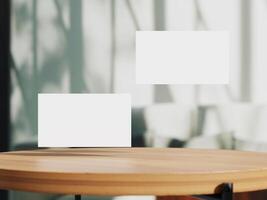 Clean minimal business card mockup on table with office background photo