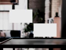 Clean minimal business card mockup on table with office background photo
