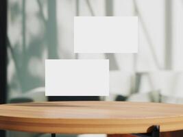 Clean minimal business card mockup on table with office background photo
