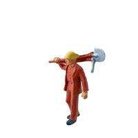 Miniature worker with a shovel slung over his shoulder. isolate on white background with clipping path photo
