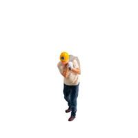 Miniature construction worker carrying a heavy sack on his back isolate on white background with clipping path photo