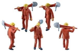Miniature worker with a shovel slung over his shoulder. isolate on white background with clipping path photo