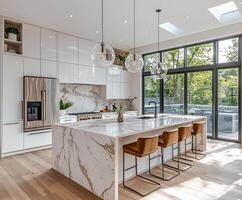 Minimalist kitchen featuring clean white cabinetry, sleek countertops, and modern appliances. photo