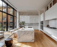 Minimalist kitchen featuring clean white cabinetry, sleek countertops, and modern appliances. photo