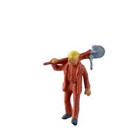 Miniature worker with a shovel slung over his shoulder. isolate on white background with clipping path photo