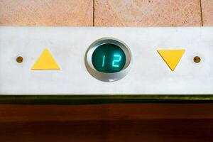 Up down.Elevator movement indicator board for floors in the building entrance photo