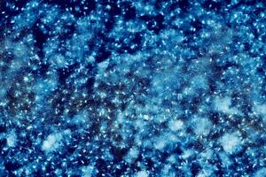 Blue poplar fluff in light flight. Abstract glowes photo