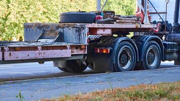 Tractor unit with empty trailer for transportation of large sized cargo photo