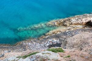 beautiful stones and bleu sea water photo
