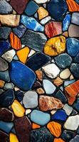 Colorful smooth pebbles tightly packed, creating a vibrant mosaic pattern. Multicolored background. photo