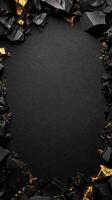 Elegant dark background with golden accents and textured surface, framed by rocks, creating a sophisticated border. Luxurious black textured backdrop with sparkling gold crystals and black gemstones photo