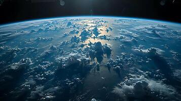The earth from space with clouds and sun photo
