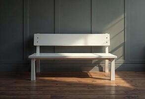 Empty white bench against a dark paneled wall with sunlight streaming in. photo