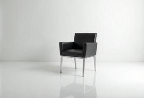 Modern black leather chair with a sleek design in a minimalist setting. photo