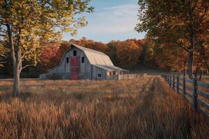 Rustic barn in an autumn field surrounded by trees with colorful leaves. photo