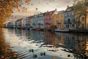 Vibrant row of colorful houses reflecting in a serene canal at dusk. photo