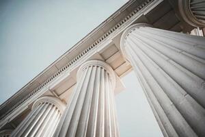 Architectural columns reaching towards the sky in a classical design. photo