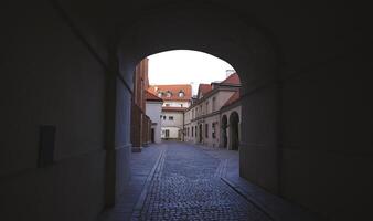 Quiet Elegance in Warsaw. Archway Framing Historic Structures, Empty Streets photo