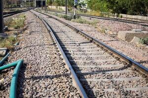 View of train Railway Tracks from the middle during daytime at Amritsar railway station in India, Train railway track view, Indian Railway junction, Heavy industry photo