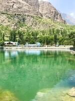 A view of Dal Lake in winter, and the beautiful mountain range in the background in the city of skardu , India. Suitable for banners, posts, social media, news, background. photo