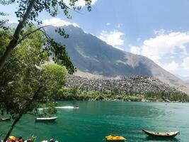 A view of Dal Lake in winter, and the beautiful mountain range in the background in the city of skardu , India. Suitable for banners, posts, social media, news, background. photo