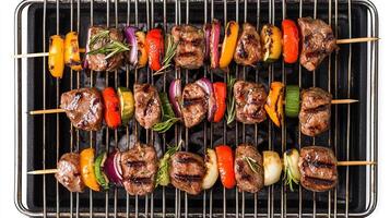 Grilled beef kebabs on skewers on a grill photo