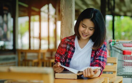 Reading books and smiling happily, brain food, learning and gaining knowledge from books in free time. photo