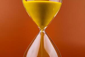 Hourglass with running out of time Concept of time and life Work with time as a deadline photo