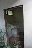A bathroom with a toilet and a sink photo