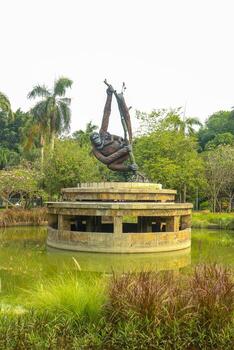 A statue of a monkey on a tree photo