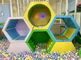 children's play area with balls and large hexagons. photo
