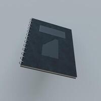 A black notebook with a white square on it photo