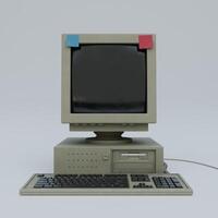 An old computer with a keyboard and monitor photo