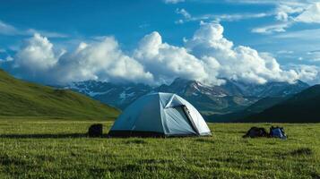 Camping on a green meadow in the mountains.. Adventure travel, nature. photo