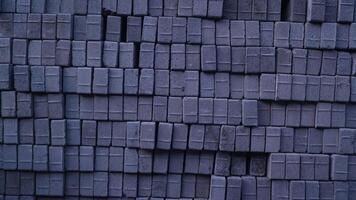 Pile of paving block, grey abstract textured background, copy space photo