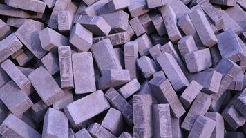 Pile of paving block, grey abstract textured background, copy space photo