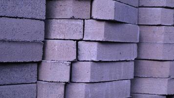 Pile of paving block, grey abstract textured background, copy space photo