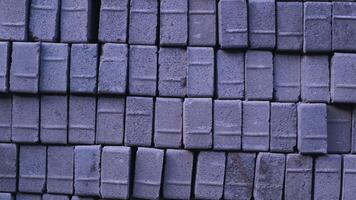 Pile of paving block, grey abstract textured background, copy space photo