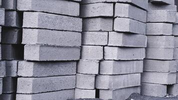 Pile of paving block, grey abstract textured background, copy space photo